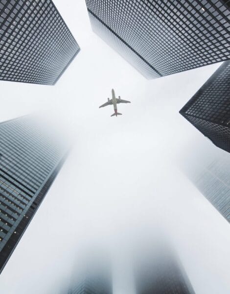Airplane passing through a city
