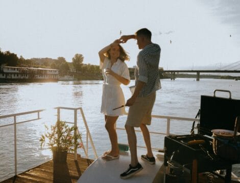 A couple dancing on a yacht.