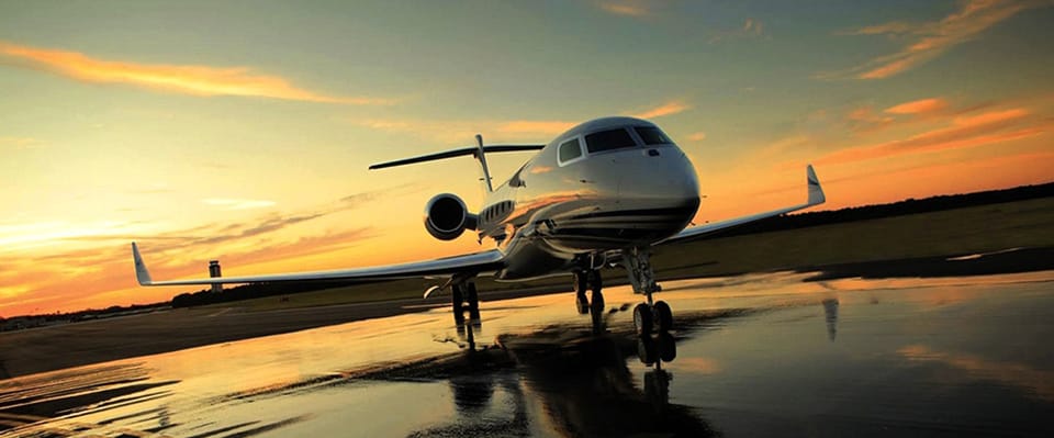 Private jet taking off at sunset 2