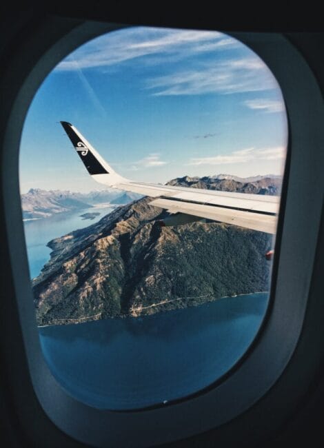 An airplane's wings being seen through its window